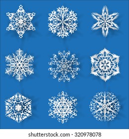Snowflakes paper set with shadow on blue background