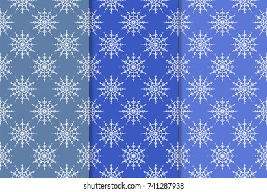 Snowflakes patterns. Set of blue seamless backgrounds with christmas elements for wallpapers and textile. Vector illustration