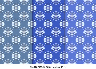 Snowflakes patterns. Set of blue seamless backgrounds with christmas elements for wallpapers and textile. Vector illustration