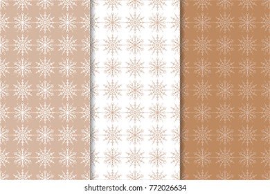 Snowflakes patterns. Set of brown and white seamless backgrounds with christmas elements for wallpapers and textile. Vector illustration