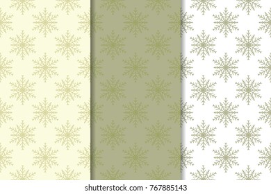Snowflakes patterns. Set of olive green and beige seamless backgrounds with christmas elements for wallpapers and textile. Vector illustration