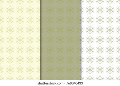 Snowflakes patterns. Set of olive green and beige seamless backgrounds with christmas elements for wallpapers and textile. Vector illustration