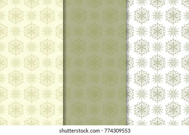 Snowflakes patterns. Set of olive green and beige seamless backgrounds with christmas elements for wallpapers and textile. Vector illustration
