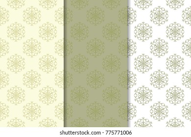 Snowflakes patterns. Set of olive green and beige seamless backgrounds with christmas elements for wallpapers and textile. Vector illustration