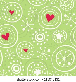 snowflakes with red hearts on green background seamless pattern