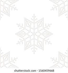 Snowflakes seamless pattern. Christmas mosaic ornament of dotted  snowflake shape of realistic white pearl. Winter celebrations print for gift paper. Vector Illustration.