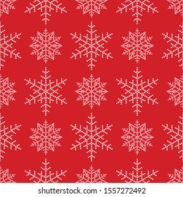 Snowflakes seamless pattern. Christmas ornament of dotted white snowflakes on red background. Winter celebrations print for gift paper. Vector Illustration.