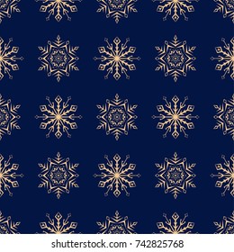 Snowflakes seamless pattern. Golden blue background with christmas elements. Vector illustration