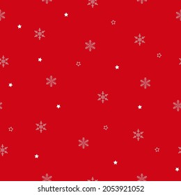 Snowflakes seamless pattern. Small white snowflakes and dots on red background. Background for winter design. Vector illustration