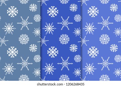 Snowflakes. Seamless patterns. Blue vertical winter ornaments. Backgrounds for textile and wallpapers