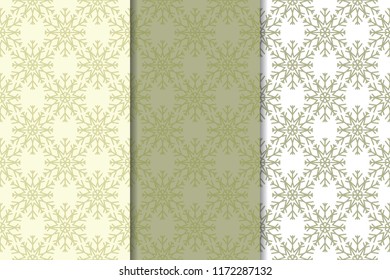 Snowflakes. Seamless patterns. Olive green winter ornaments. Backgrounds for textile and wallpapers