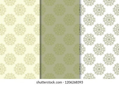Snowflakes. Seamless patterns. Olive green winter ornaments. Backgrounds for textile and wallpapers