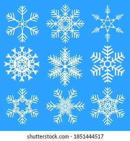 Snowflakes set on blue background. isolated snowflake white silhouette. Christmas season design elements.