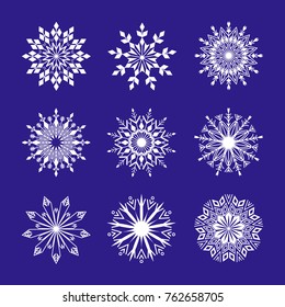 Snowflakes set on blue background. Winter Holidays Decorative design elements.