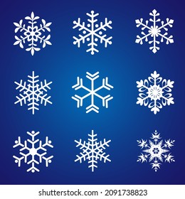 Los copos de nieve se colocan sobre un fondo azul oscuro. Ilustración vectorial de copos de nieve planos. Elementos de diseño de la Decoración de las vacaciones de invierno.