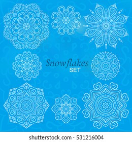 Snowflakes set. Round decorative ornaments for creativity. Doodle drawing, ethnic motifs. New Year, Christmas, winter decor