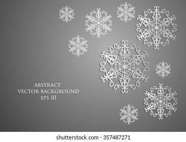 snowflakes with shadow on a gray background. 