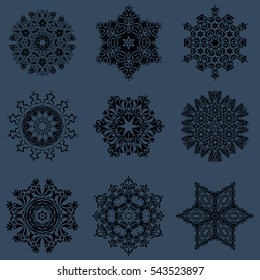Snowflakes, snowfall, doodles, abstract. Falling Christmas stylized snowflakes. Set of beautiful vector snowflakes isolated on a blue background.