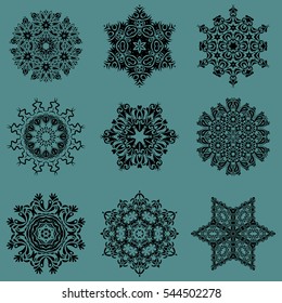 Snowflakes, snowfall, doodles, abstract. Falling Christmas stylized snowflakes. Set of beautiful vector snowflakes isolated on a blue background.