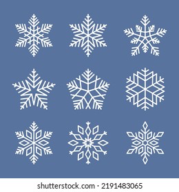 Snowflakes Vektorsymbole Sammlung. Weiße Vektorelemente auf blauem Hintergrund. Das Beste für nahtlose Muster, Dekoration und Design.