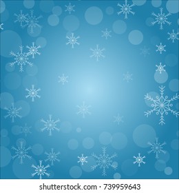 Snowflakes in winter with blue background.