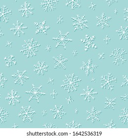 Snowflakes winter and Christmas seamless pattern on blue background, vector illustration. Snowfakes background for greeting cards, wallpaper, gift paper or winter decorations.