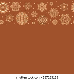 Snowflakes winter New Year frame on brown background with copy space (place for your text).