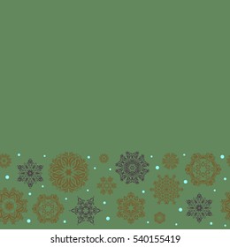Snowflakes winter New Year frame on green background with copy space (place for your text).