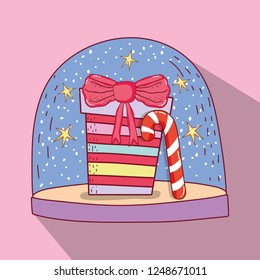 snowing glass ball with present and candy cane