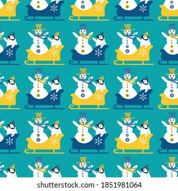 Snowman and baby penguin sledging seamless vector pattern background. Blue yellow geometric backdrop with laughing snowmen, small penguins sitting in sledges with arms in the air. Funky winter scene