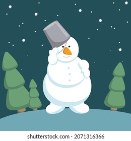 Snowman with a bucket on his head and a carrot nose on a hill with Christmas trees.