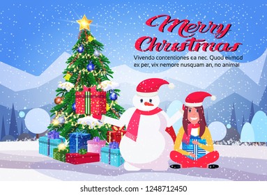 snowman with girl lotus pose holding wrapped gift box present near decorated fir tree merry christmas new year holiday concept winter mountain forest landscape flat