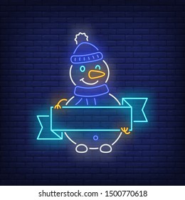 Snowman holding blank ribbon frame neon sign. Winter season, Christmas design. Night bright neon sign, colorful billboard, light banner. Vector illustration in neon style.