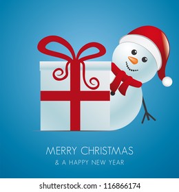 snowman with santa hat behind gift box
