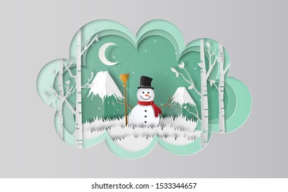 Snowman standing on grass with mountain background, Merry Christmas and Happy New Year concept.