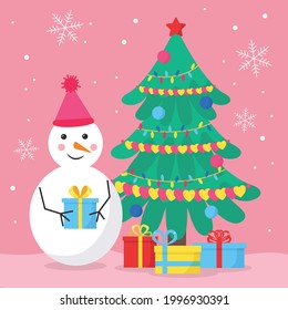 Snowman in a warm pink hat with a bubo lays a present in a pile of gifts under a Christmas tree decorated with garlands of hearts and balls. The pink background for a greeting card, add text.