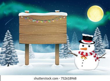 snowman and wood board sign in nigth winter forest