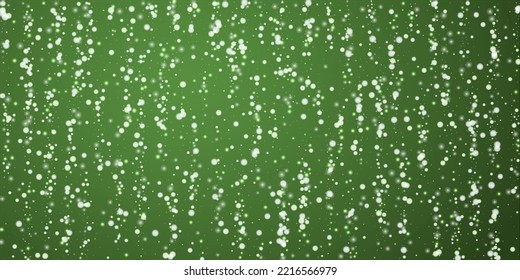 Snowy christmas background. Subtle flying snow flakes and stars on christmas green background. Delicate sweet snowy christmas. Wide vector illustration.