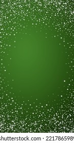 Snowy christmas background. Subtle flying snow flakes and stars on christmas green background. Delicate sweet snowy christmas. Vertical vector illustration.