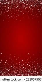 Snowy christmas background. Subtle flying snow flakes and stars on christmas red background. Delicate sweet snowy christmas. Vertical vector illustration.