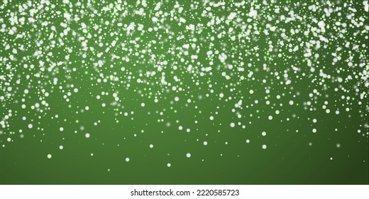 Snowy christmas background. Subtle flying snow flakes and stars on christmas green background. Delicate sweet snowy christmas. Wide vector illustration.