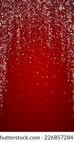Snowy christmas background. Subtle flying snow flakes and stars on christmas red background. Delicate sweet snowy christmas. Vertical vector illustration.