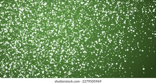 Snowy christmas background. Subtle flying snow flakes and stars on christmas green background. Delicate sweet snowy christmas. Wide vector illustration.