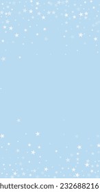 Snowy christmas background. Subtle flying snow flakes and stars on light blue winter backdrop. Delicate sweet snowy christmas. Vertical vector illustration.