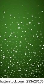Snowy christmas background. Subtle flying snow flakes and stars on christmas green background. Delicate sweet snowy christmas. Vertical vector illustration.