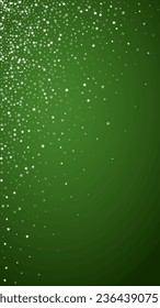 Snowy christmas background. Subtle flying snow flakes and stars on christmas green background. Delicate sweet snowy christmas. Vertical vector illustration.