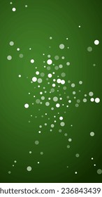 Snowy christmas background. Subtle flying snow flakes and stars on christmas green background. Delicate sweet snowy christmas. Vertical vector illustration.