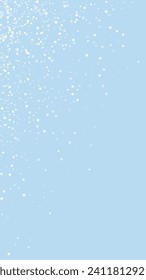 Snowy christmas background. Subtle flying snow flakes and stars on light blue winter backdrop. Delicate sweet snowy christmas. Vertical vector illustration.