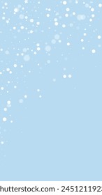 Snowy christmas background. Subtle flying snow flakes and stars on light blue winter backdrop. Delicate sweet snowy christmas. Vertical vector illustration.
