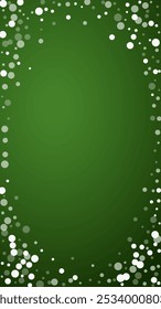Snowy christmas background. Subtle flying snow flakes and stars on christmas green background. Delicate sweet snowy christmas. Vertical vector illustration.